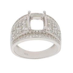 Sterling silver semi mount ring setting with cushion cut slot for 9x7mm white topaz, featuring intricate designs.
